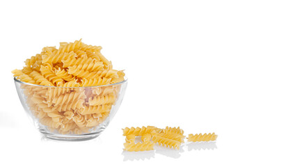 Pasta products in the form of a spiral on a plate, texture, on a white background