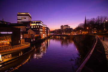 Buildings by the river in Bristol, England at dusk