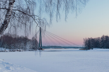 bridge over a frozen river in the winter Helsinki Finland