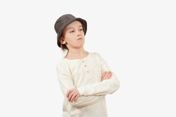 Serious boy thinking isolated on white background. Positive teen boy crossing arms.