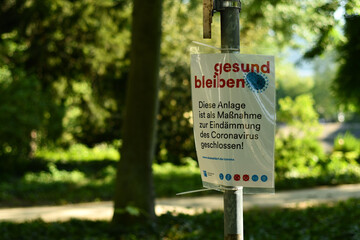 Stay healthy Sign with Covied-19 with hints and rules in a park in Duesseldorf, Germany