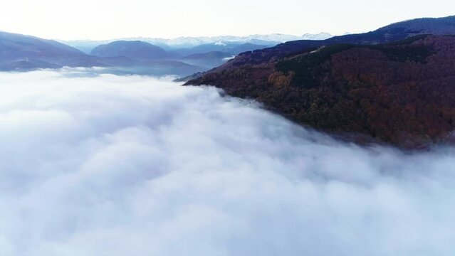 Flying over the clouds that cover the valley