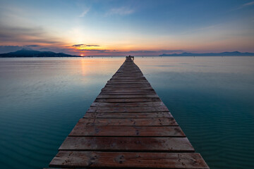 Naklejka na ściany i meble wooden pier at sunset