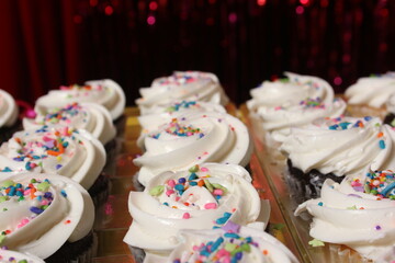 Cupcakes with Sprinkles on Table at Birthday Party