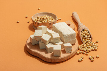 Fresh Tofu cheese with soybeans. Cube pieces, healthy ingredient for vegan lifestyle, modern stand