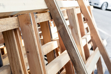 Wooden pallets stacked outdoors. building materials