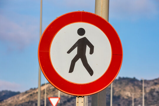 Pedestrian Safety: Round Road Sign Prohibiting Foot Traffic