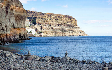 Two small stack of stones on the beach, Gran Canary, Spain © Sunday