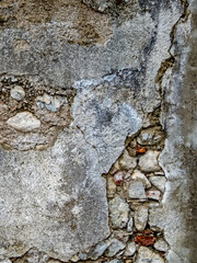 Oberfläche einer verfallenen steinernen Mauer als Hintergrund