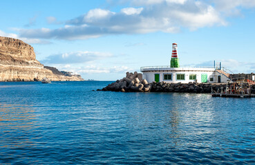 Fototapeta na wymiar Small Lighthouse in the port Puerto De Mogan