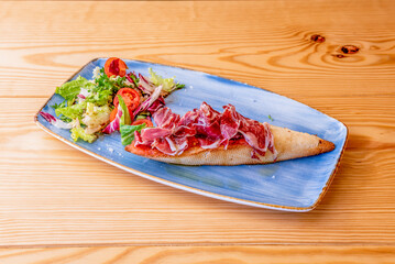 Iberian ham is a type of serrano ham from the Iberian pig, highly regarded in Spanish and Portuguese gastronomy, which is considered an haute cuisine item and an exquisite delicacy