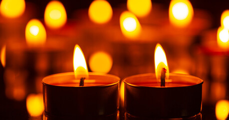 macro candle,Burning candles on a dark memorial day surface