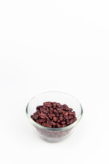 Red kidney beans in glass bowl isolated on white background with clipping path