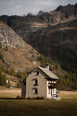 Fototapeta na wymiar An isolated mountain hut located in the highland of Alpe Devero, Northern Italy, during morning