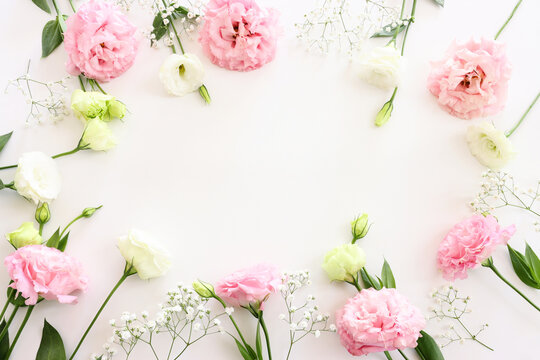 Top view image of delicate bouquet flowers over isolated white background
