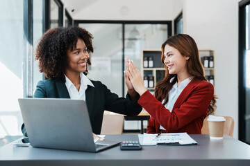 Multiethnic business, Beautiful American African and asian businesswoman people meeting Diverse Happy people celebrating success at company, teamwork, triumph, victory, achievement concept