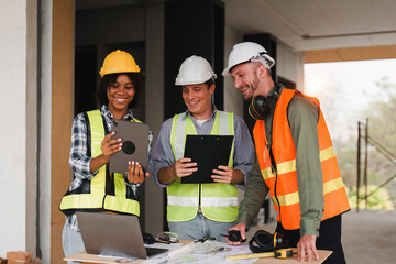 Engineer and Foreman builder team at construction site. American African foreman construction standing at construction site