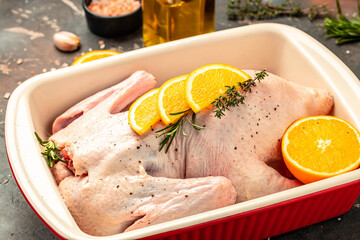 fresh whole raw duck with orange thyme and spices, prepare to cook, banner, menu, recipe place for text, top view