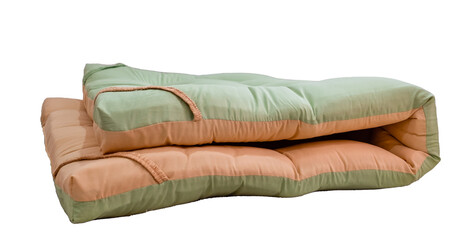 Fototapeta na wymiar top view A white di-cut background image (isolate) of the folded orange and green mattress topper.
