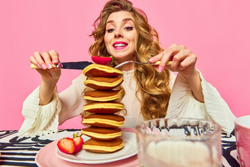 Food pop art. Adorable girl with red hair starting eat giant portion of pancakes with enjoying...