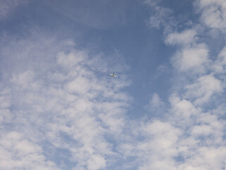 Airplane high in the sky in the morning above The Hague, Netherlands.