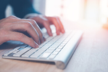 businessman typing on keyboard on office table, working space, working from home