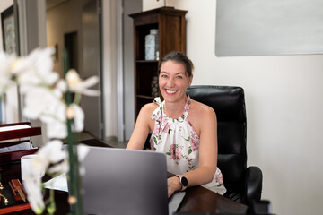 Cheerful Businesswoman Embracing Tech