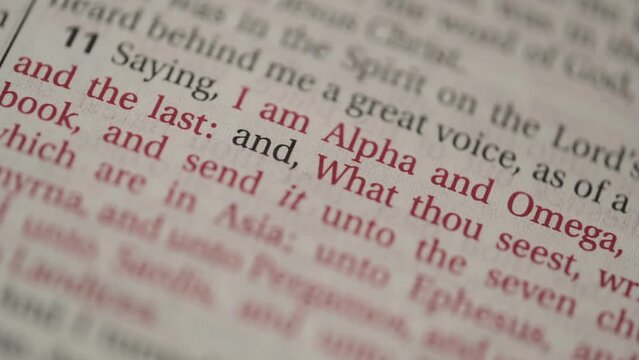 Bible close up text Alpha and Omega from John Revelation   