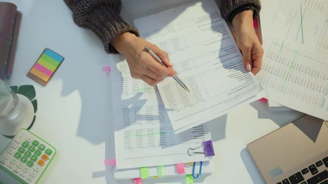 tax time. accountant woman working with documents.