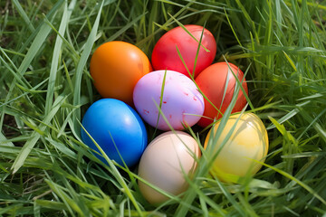 a bunch of colorful eggs in the grass
