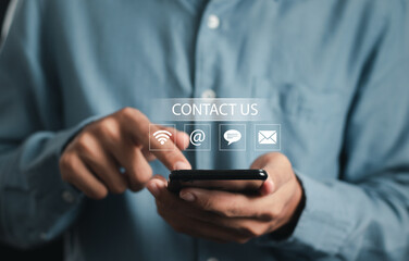 Contact us. businessman using smartphone with icon (wifi, address, chat, email) . Support concept.