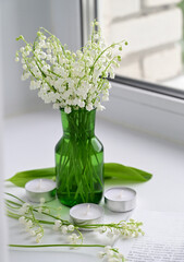 Composition of lily of the valley. Spring concept. A gift to a woman.