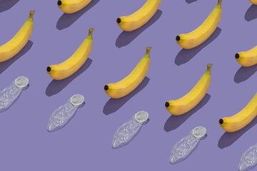 Pattern with bananas and condoms against purple background. Safe sex concept.