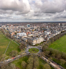 Aerial townscape view of Harrogate with traffic and The Stray public park