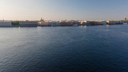 Fototapeta premium Aerial view above water of the Peter-Pavel's Fortress next to bridges on the river and water channel in the historical centre of city of St. Petersburg at sunny summer sunrise 