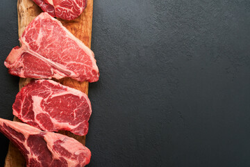Raw prime steaks. Variety of fresh black angus prime meat steaks T-bone, New York, Ribeye,...