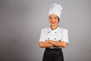 head chef, Brazilian cook, from the Northeast, posing for a photo, smiling. crossed arms.