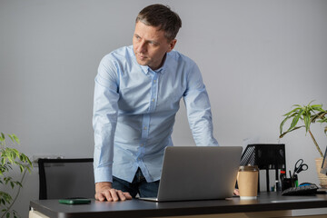 Man work with laptop in office.