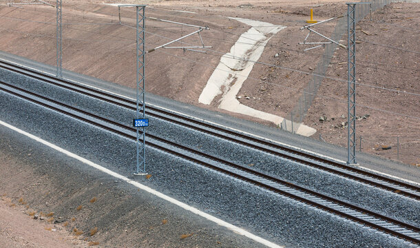 Dual gauge railway tracks with power lines