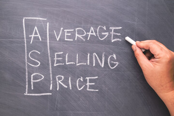Hand writing an ASP acronym of Average Selling Price on blackboard