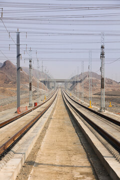 Railroad with powerlines under construction in summertime