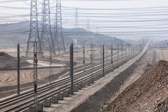 Railroad with powerlines under construction in summertime