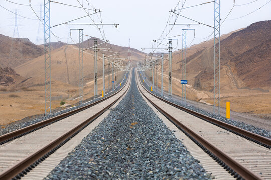 Railroad with powerlines under construction in summertime