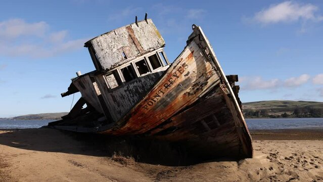 Historic wooden ship wrecked on deserted beach in Point Reyes, California