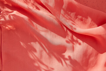 Natural chiffon fabric background under shadows on sunny day