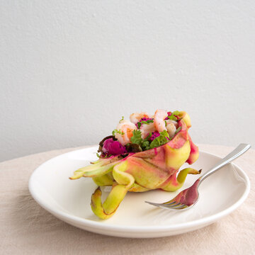 salad with shrimp and pitahaya on a light table