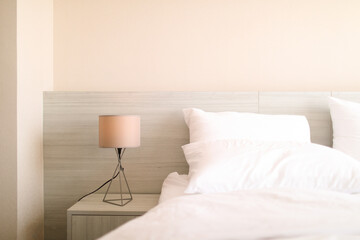 bed in a modern white tone loft room