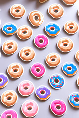 Colorful Donuts Flat Lay On A Plain Color Background created with generative ai technology