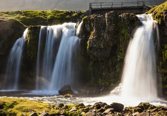 Scenic view of Kirkjufellsfoss waterfall with long exposure on a rainy day, Iceland