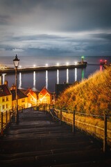 Famous 199 Steps leading to St Mary's Church in Whitby, North Yorkshire at dusk